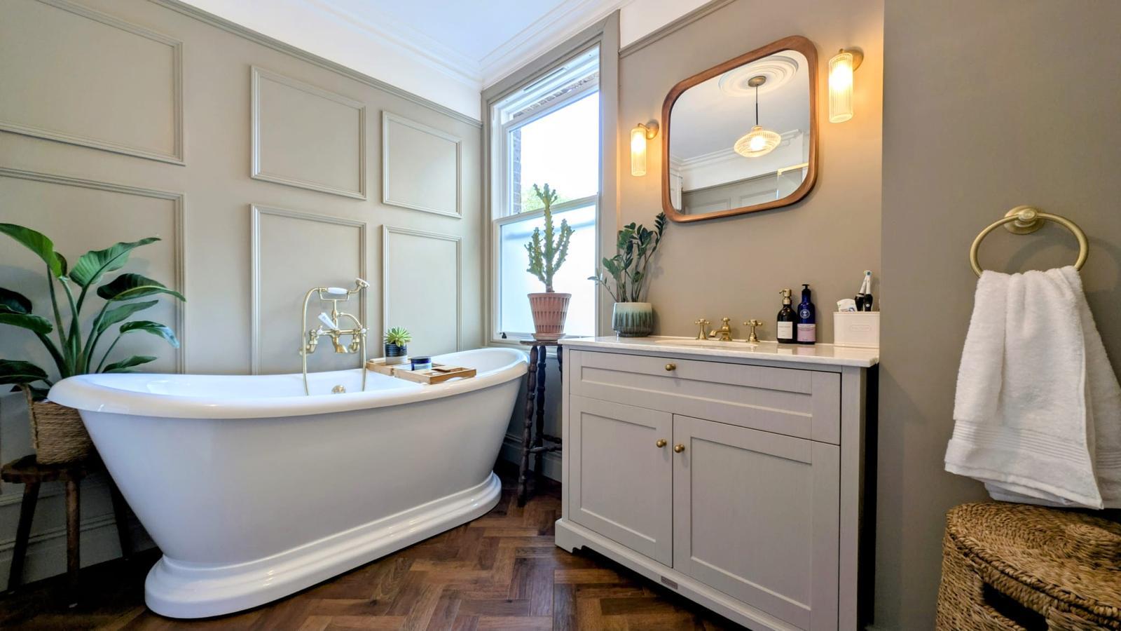 A serene bathroom with freestanding tub by BKE Installations